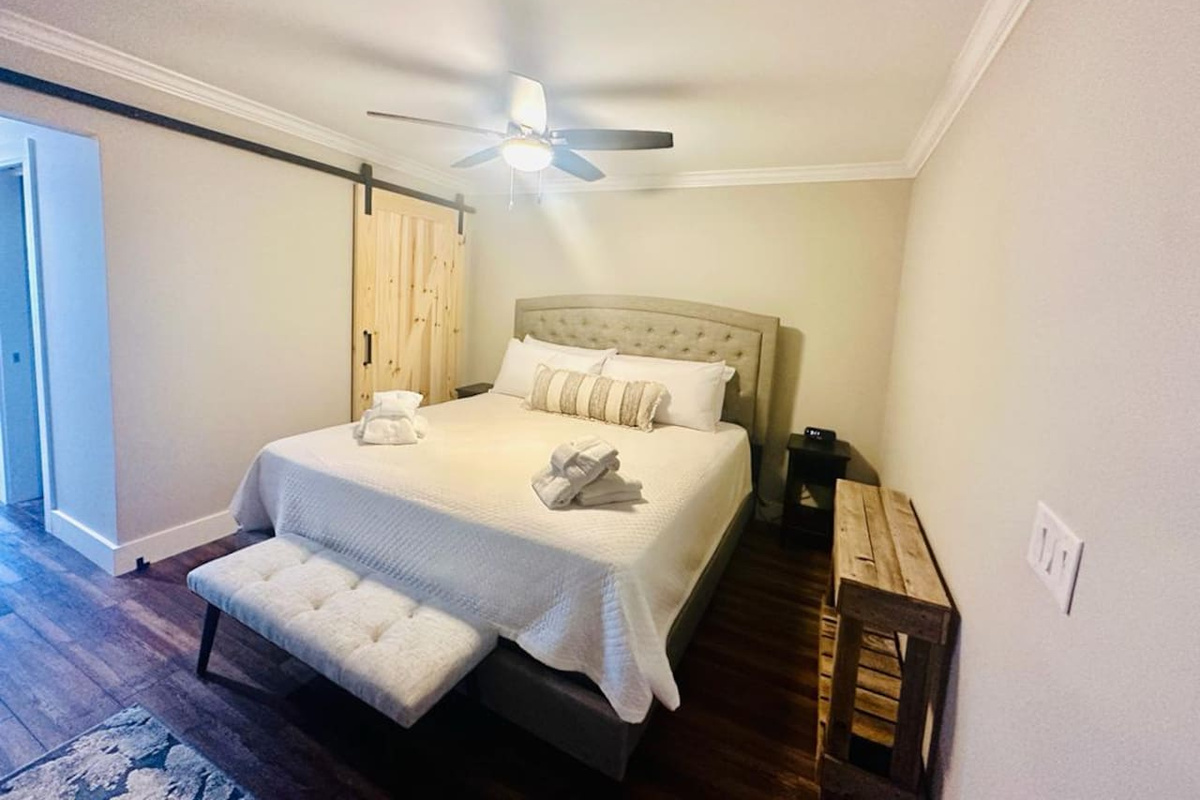 King bedroom with barn door