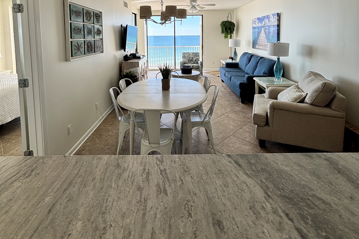 Open living space with comfortable seating and easy access to the beachfront balcony.