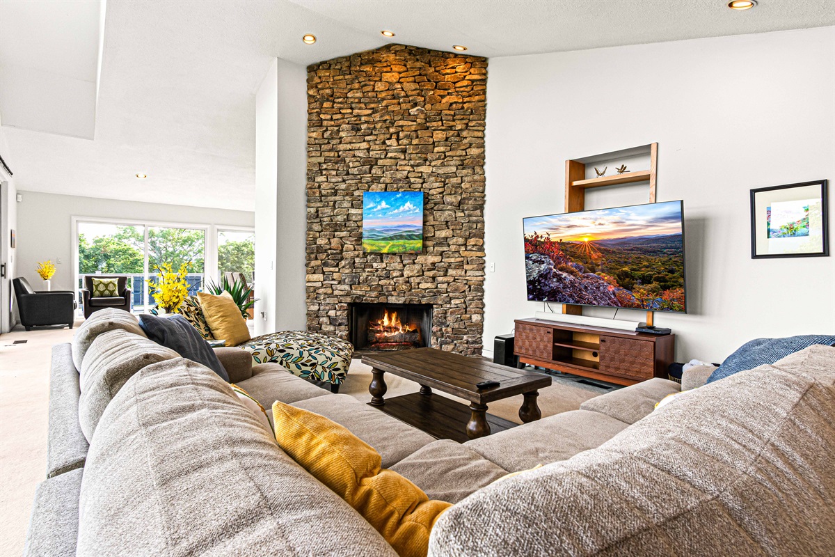 Living Room: Enjoy striking stone accents and bright views for perfect relaxation!