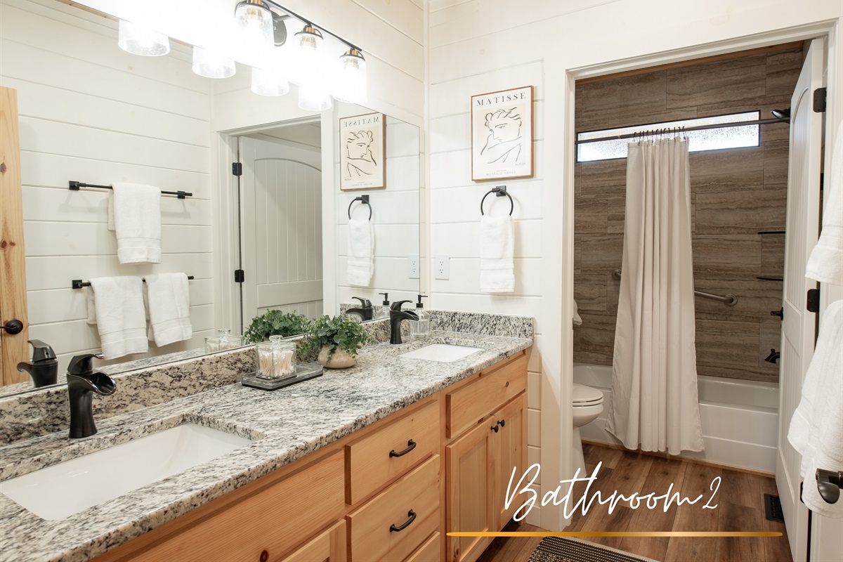 Bathroom 2 is bright and clean with subtle charm, offering everything you need to refresh and recharge.