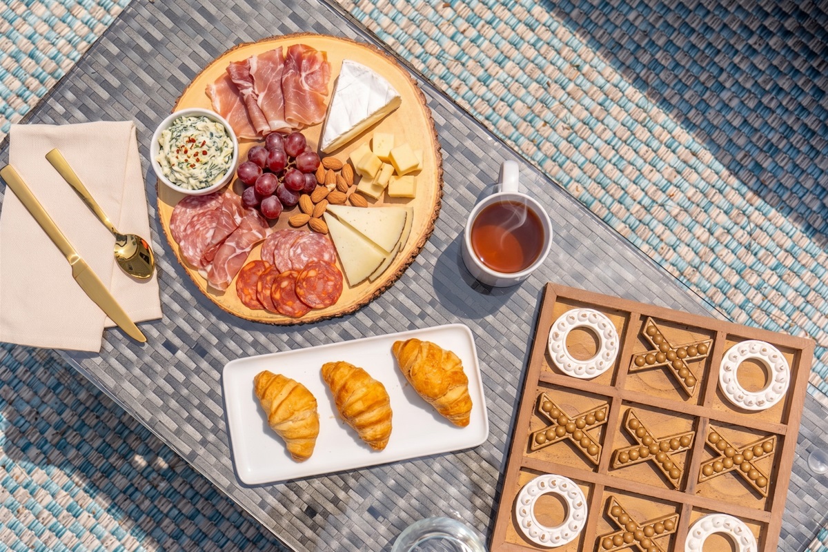 A welcoming outdoor patio seating area designed for comfort and connection, perfect for sharing snacks, enjoying refreshments, and having drinks together in a relaxed setting.