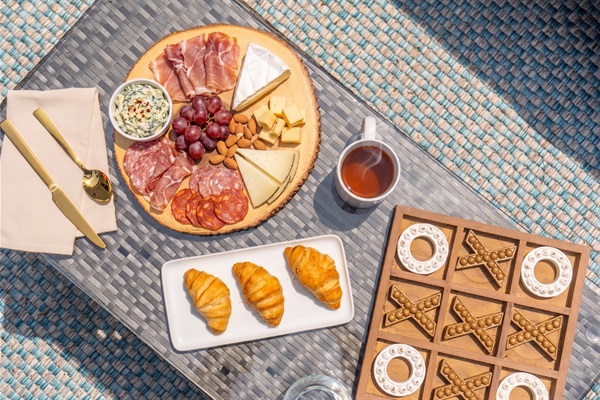 A welcoming outdoor patio seating area designed for comfort and connection, perfect for sharing snacks, enjoying refreshments, and having drinks together in a relaxed setting.