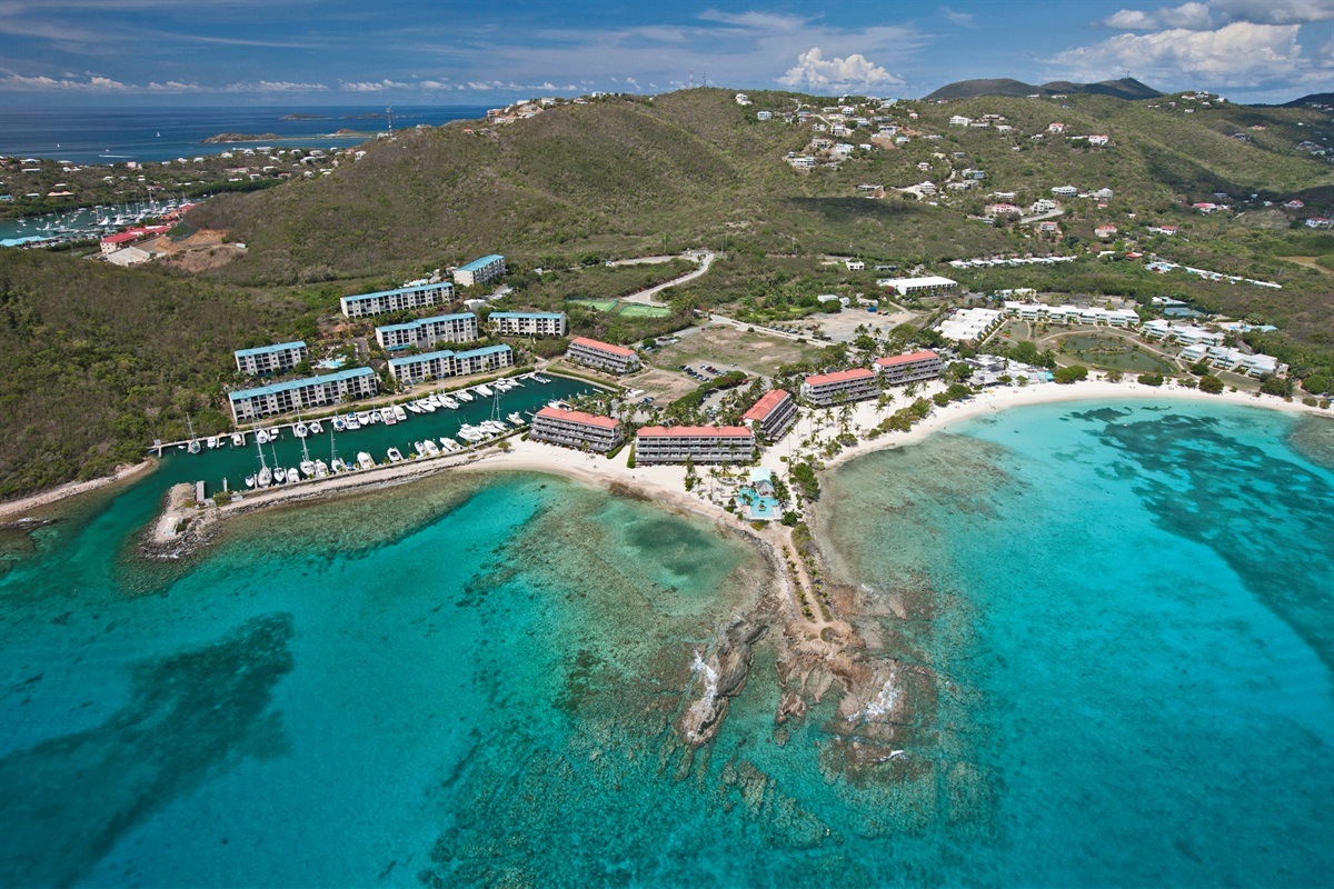 Stunning aerial view showcasing the resort&rsquo;s prime beachfront location and crystal-clear waters.
