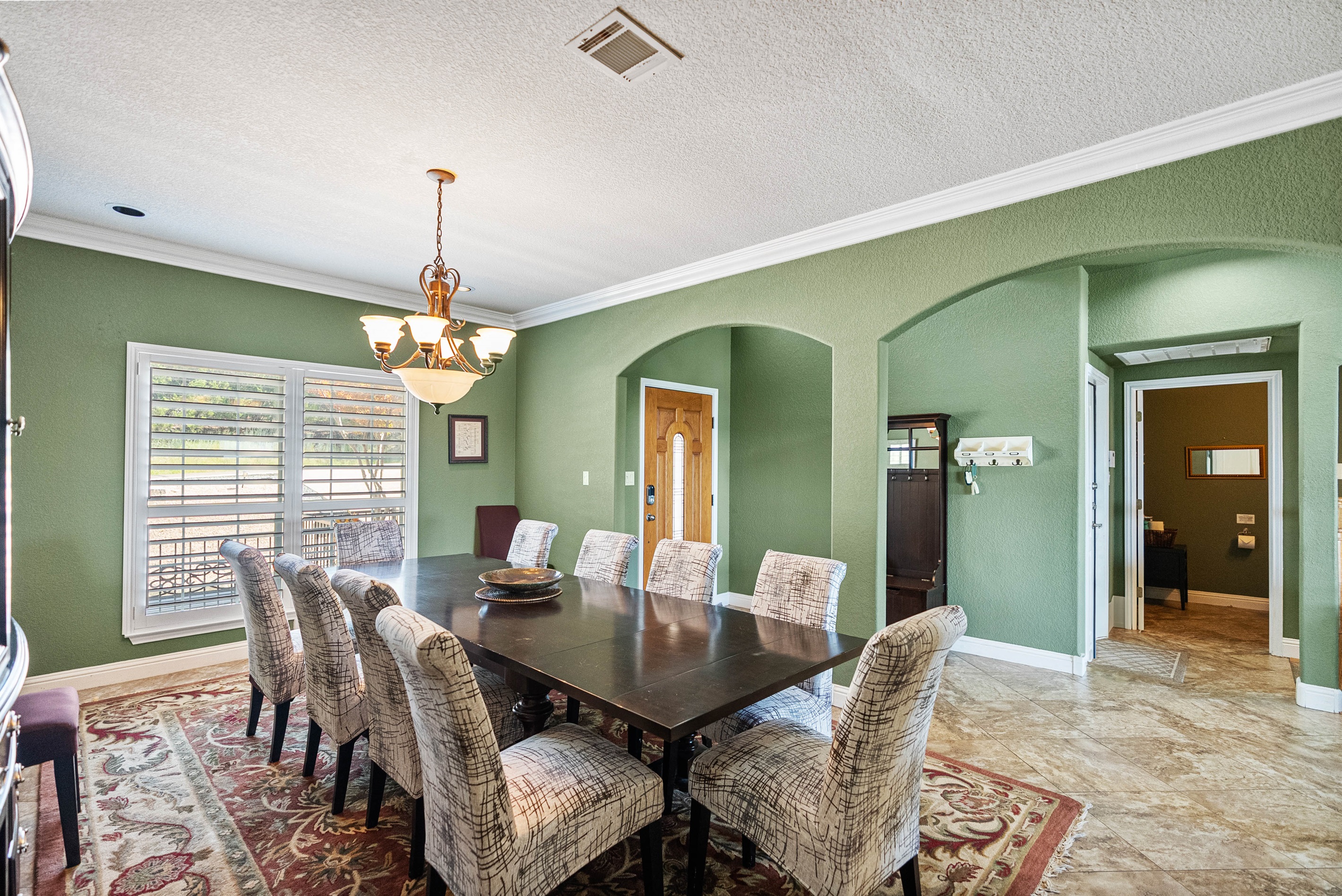 Spacious dining area with seating for 10, perfect for family meals and group gatherings.