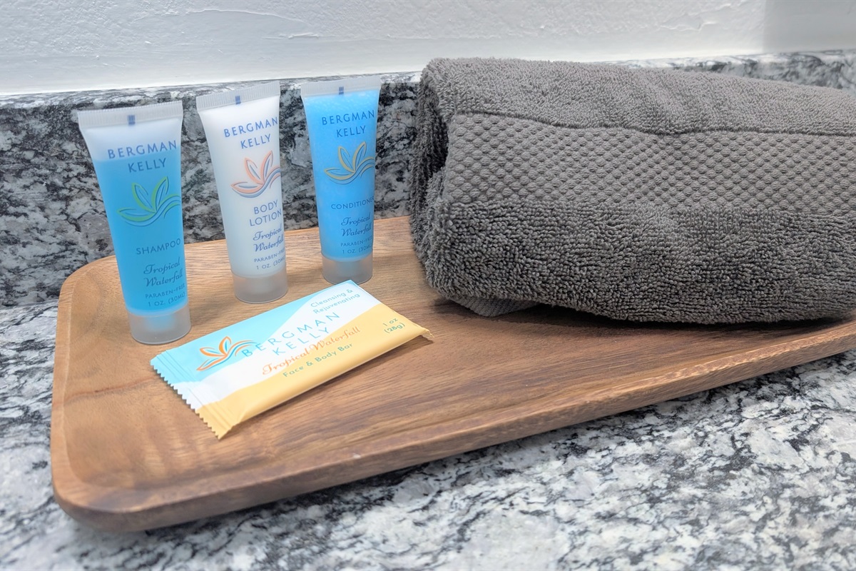 Toiletries including soap, lotion, shampoo and conditioner are stocked in this home. 