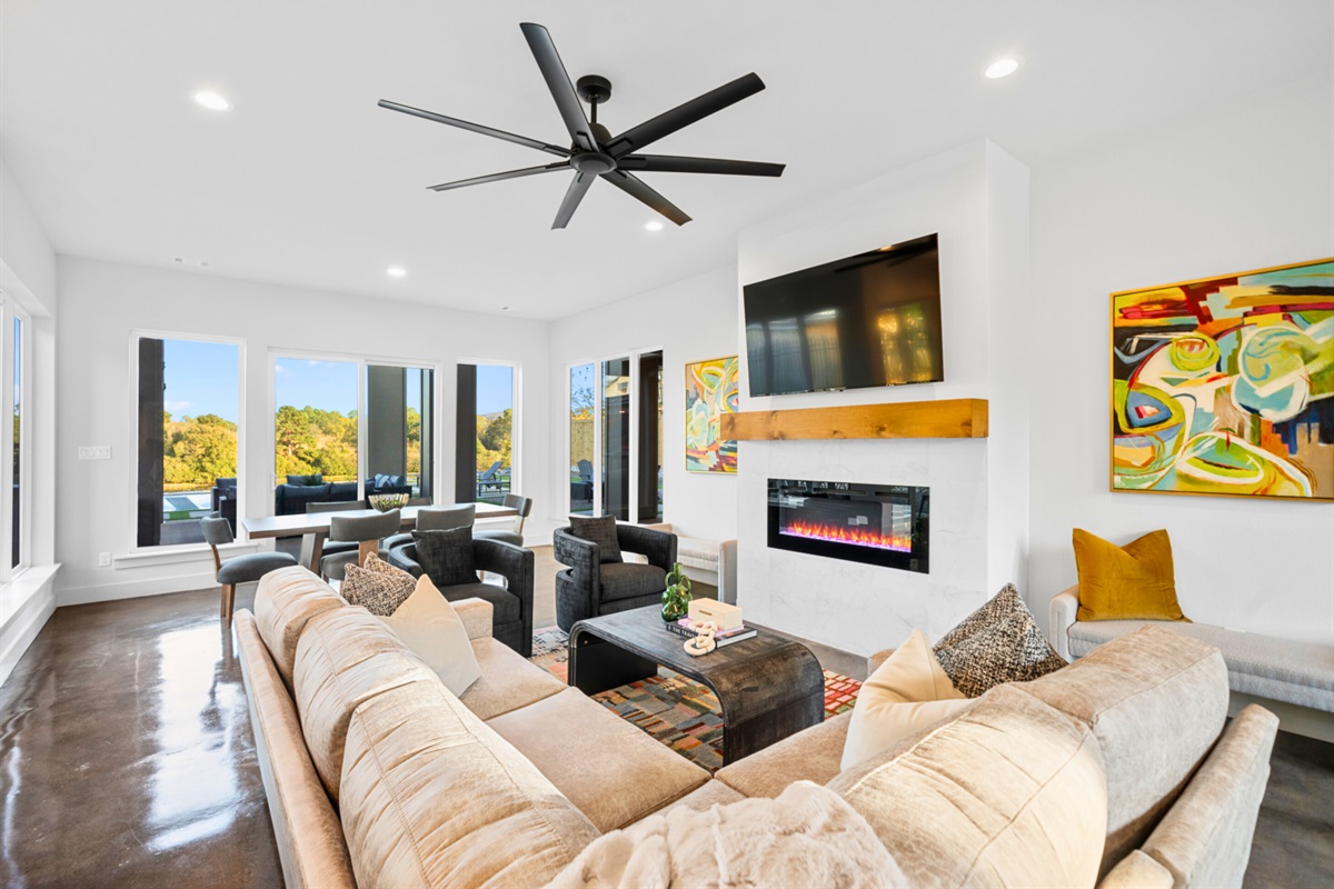 Another view of this inviting living room, full of comfy seating and warm ambiance &ndash; a perfect place for gathering and relaxing.