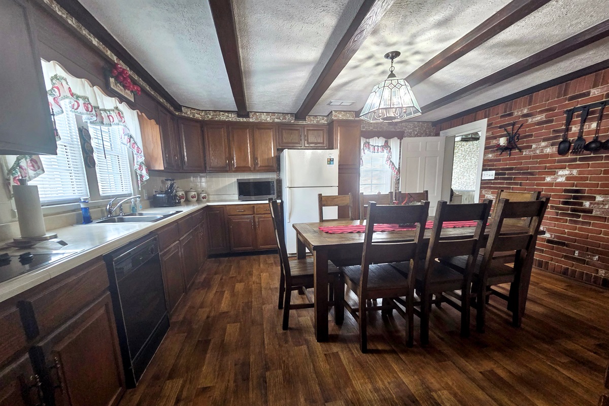 The farmhouse kitchen is warm and inviting, with plenty of room for gatherings, meal prep, and making memories together.