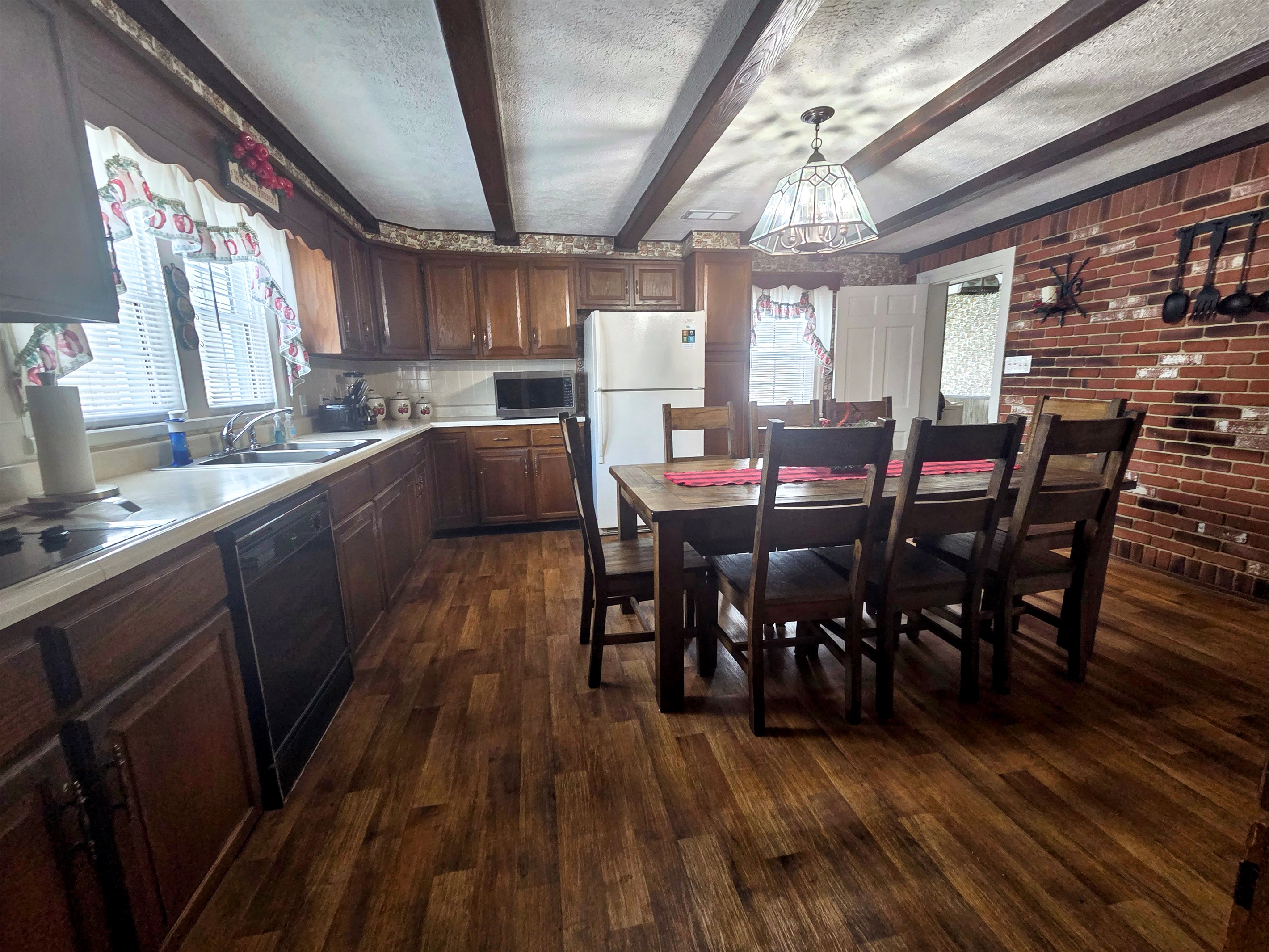 The farmhouse kitchen is warm and inviting, with plenty of room for gatherings, meal prep, and making memories together.