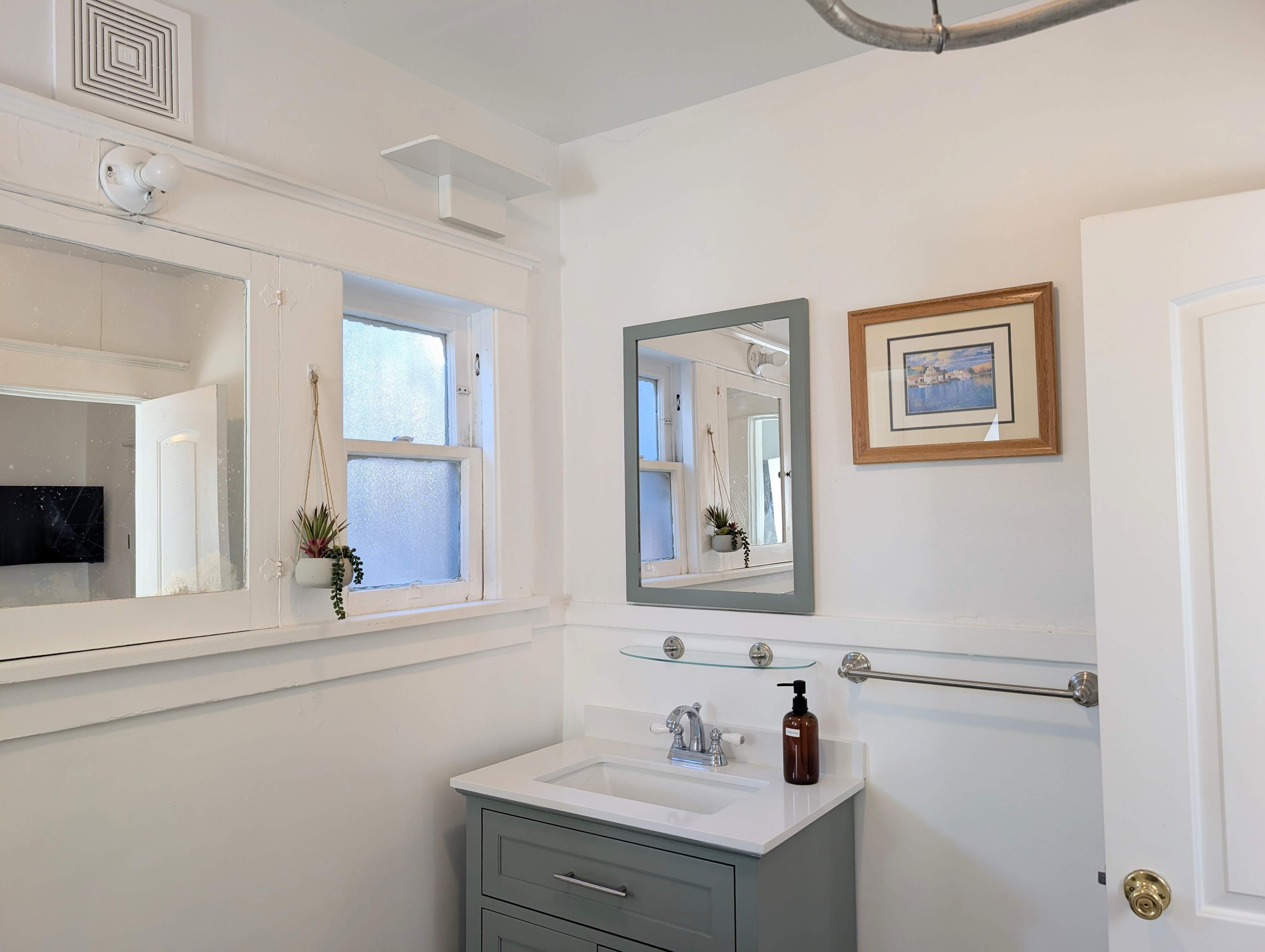 Enjoy a well-appointed bathroom with a modern vanity, ample counter space, fresh towels, and complimentary bath essentials to make your stay effortless.