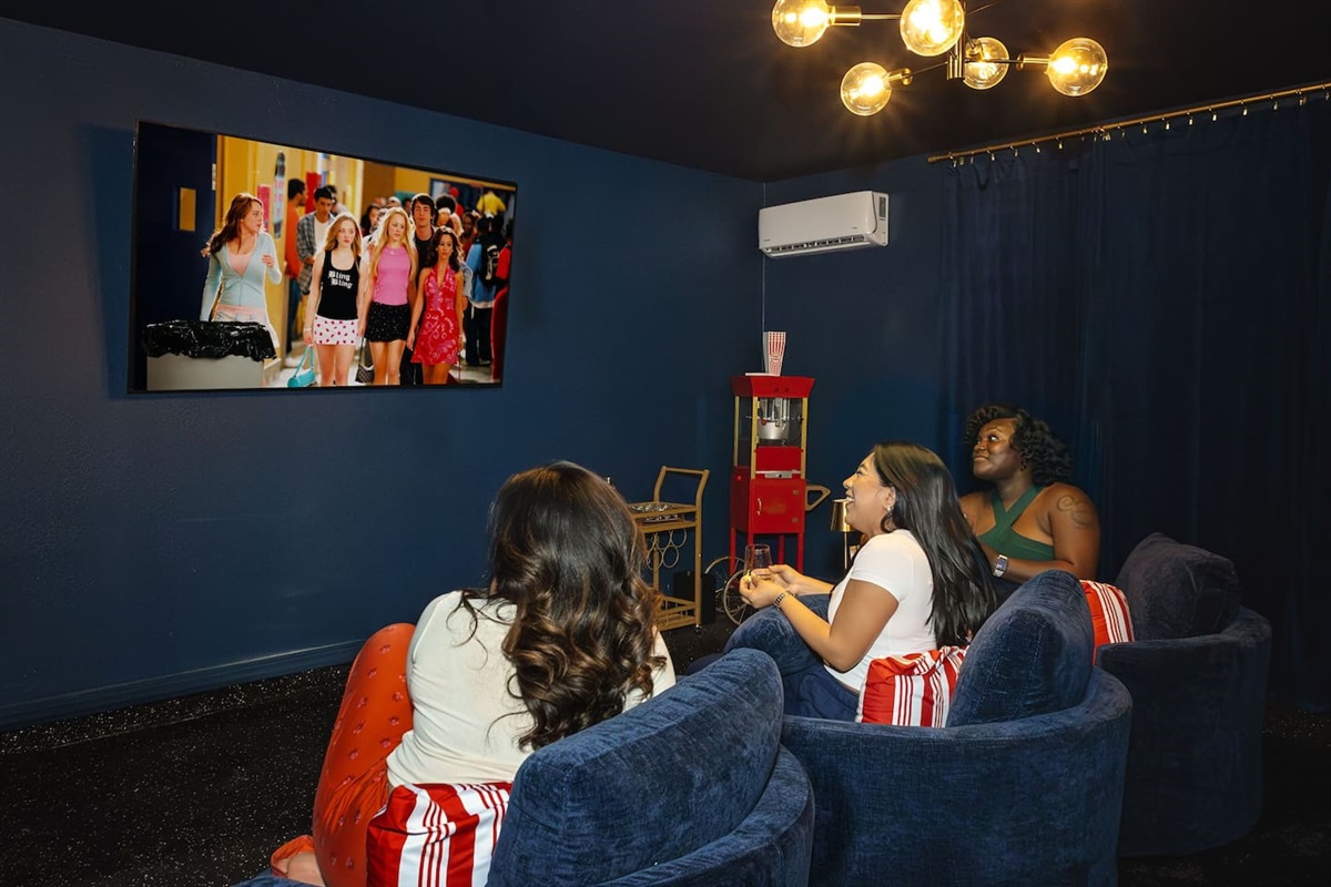 Enjoy a girls' night in your very own private movie theater. Cozy up on plush seating, pop some popcorn, and relax as you watch your favorite films, creating memories with friends in a space made just for fun and laughter.