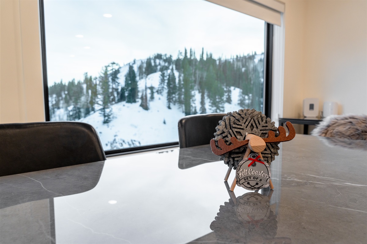 Dining details framed by alpine scenery.