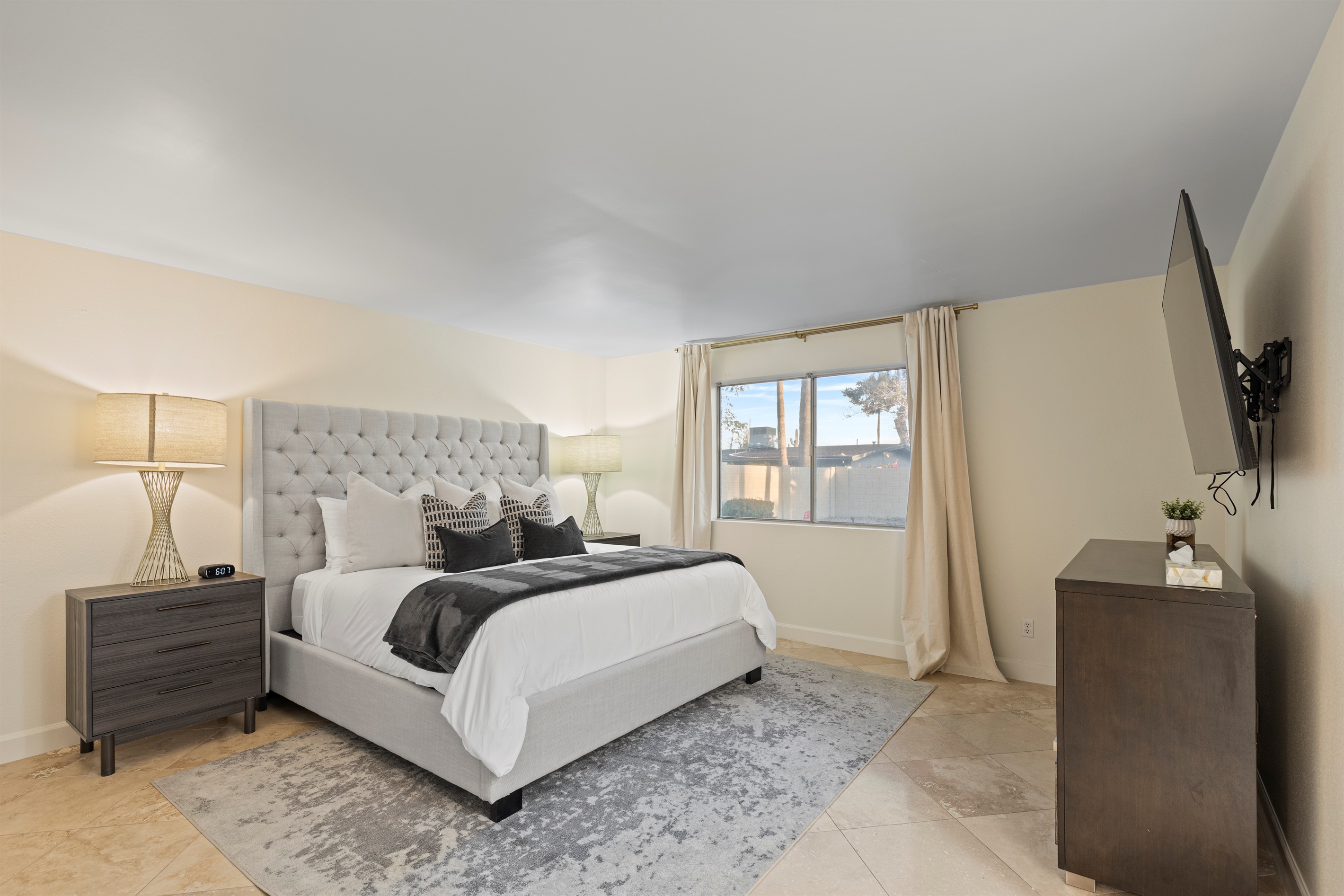 Comfortable and spacious bedroom with natural light and thoughtful design