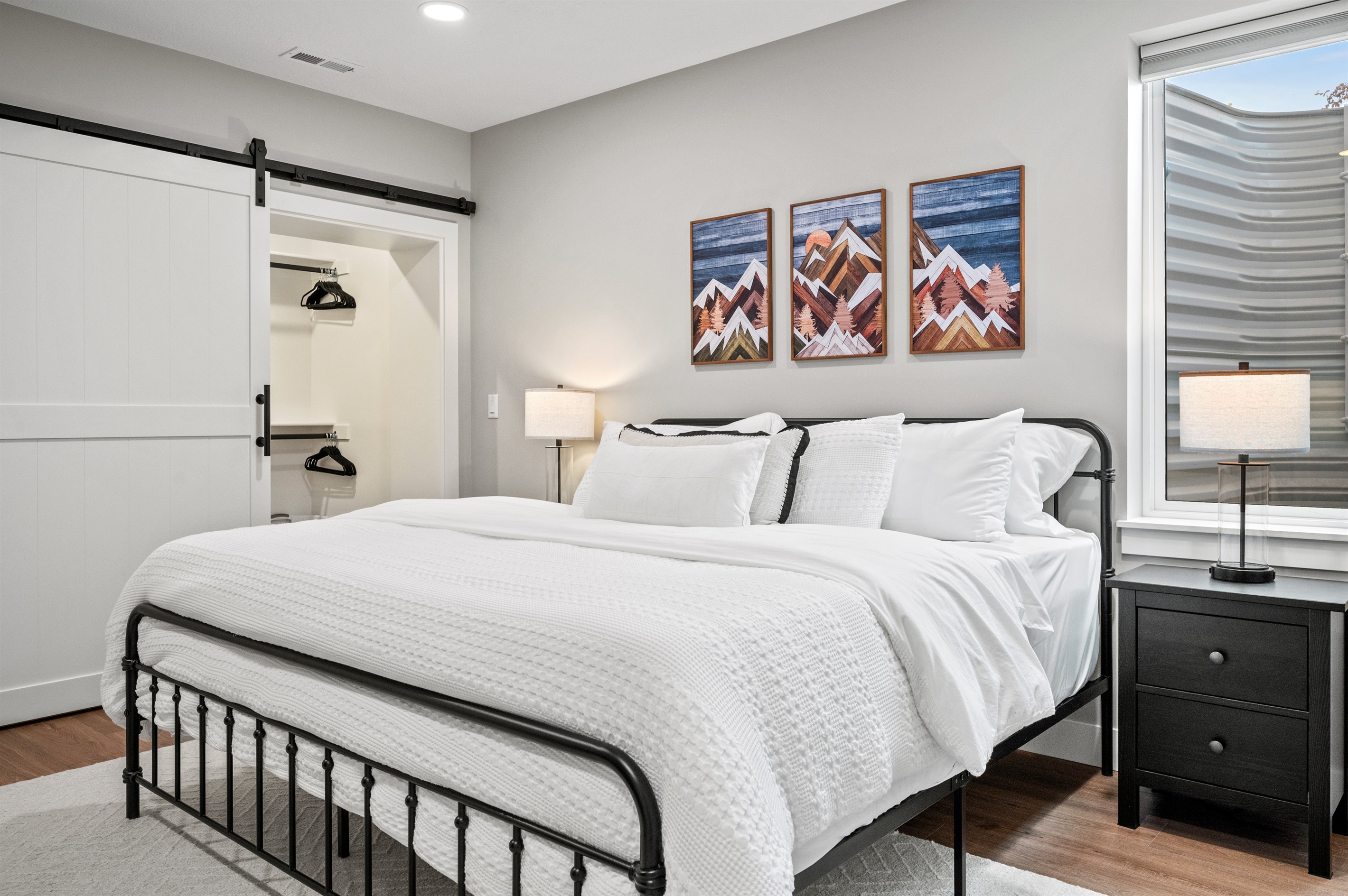 King bed with a walk-in closet and luxurious linens for a restful, indulgent stay.