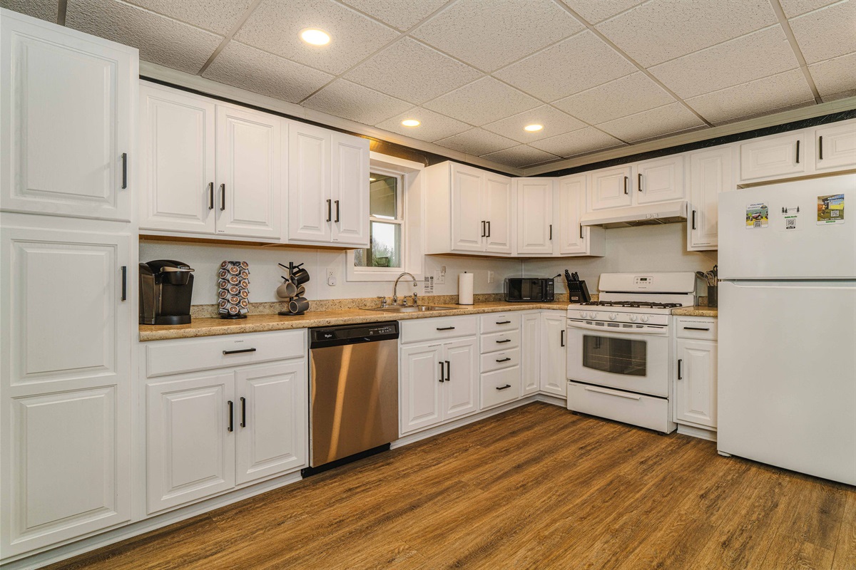 Second Full Kitchen for Large Groups A fully equipped downstairs kitchen with modern appliances—ideal for multi-family stays.
