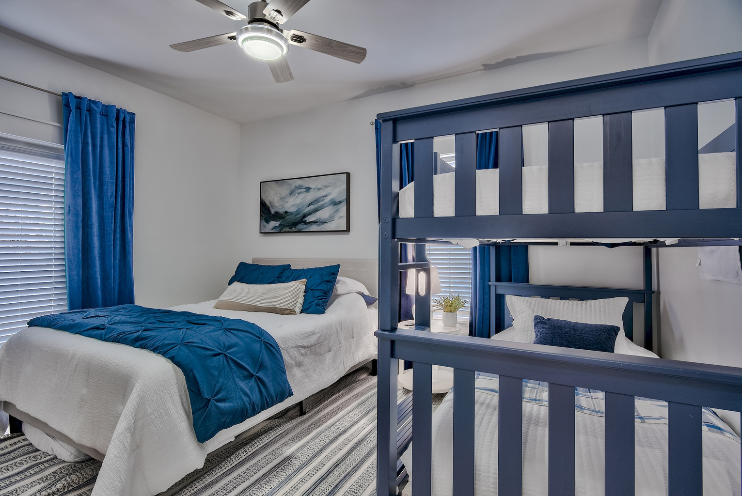 Second bedroom with bed and bunk bed