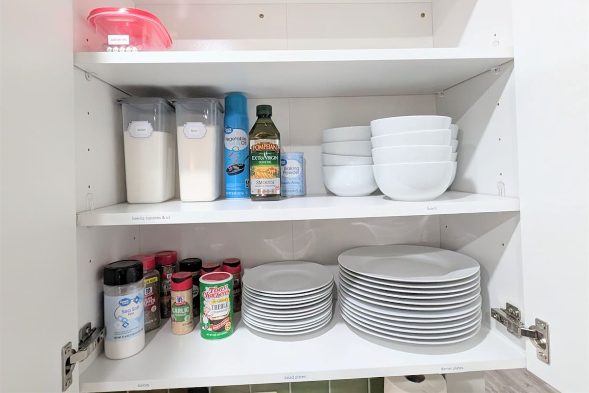 Plenty of dinner ware, spices, and baking supplies. 