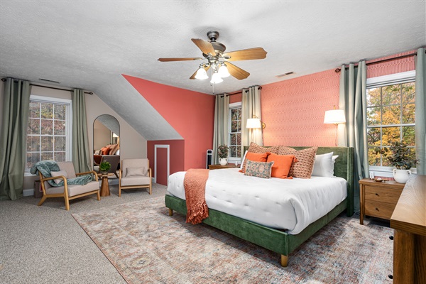 A cheerful king suite with vibrant accents, natural light, and inviting textures that brighten every morning.