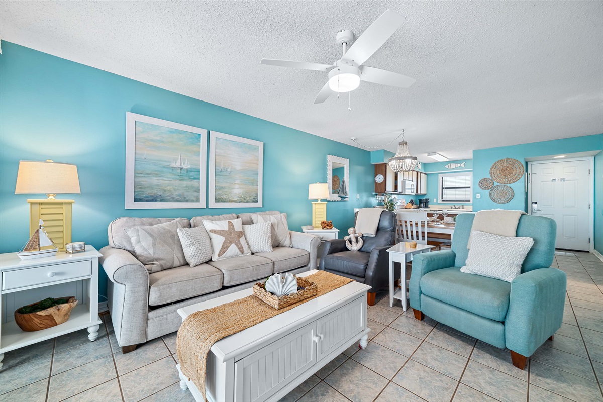 Maximize your comfort and sleeping arrangements with our versatile living area, showcasing a convenient sleeper sofa. Enjoy stunning panoramic ocean vistas right from your accommodation.