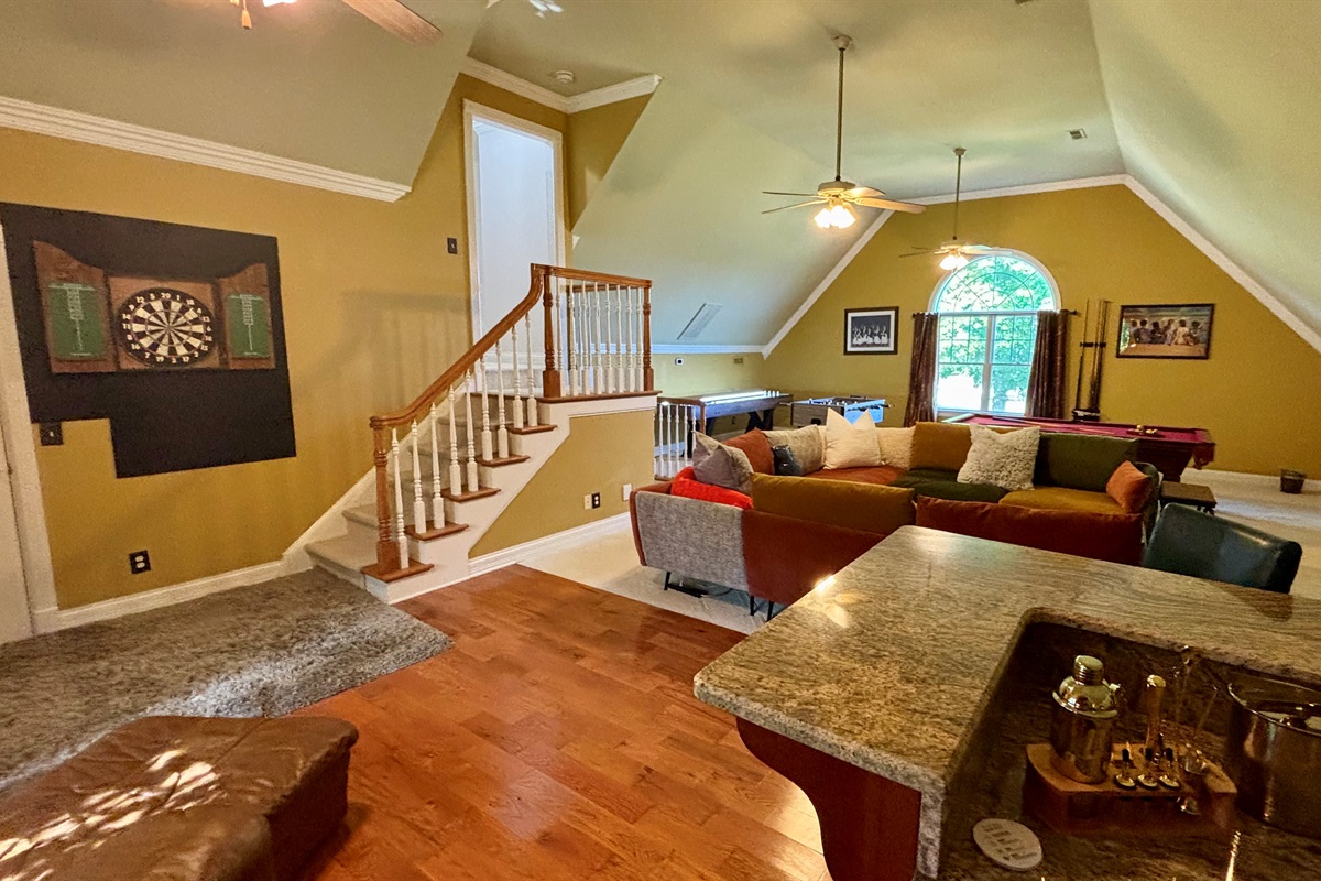 The game room connects to both upstairs and downstairs!