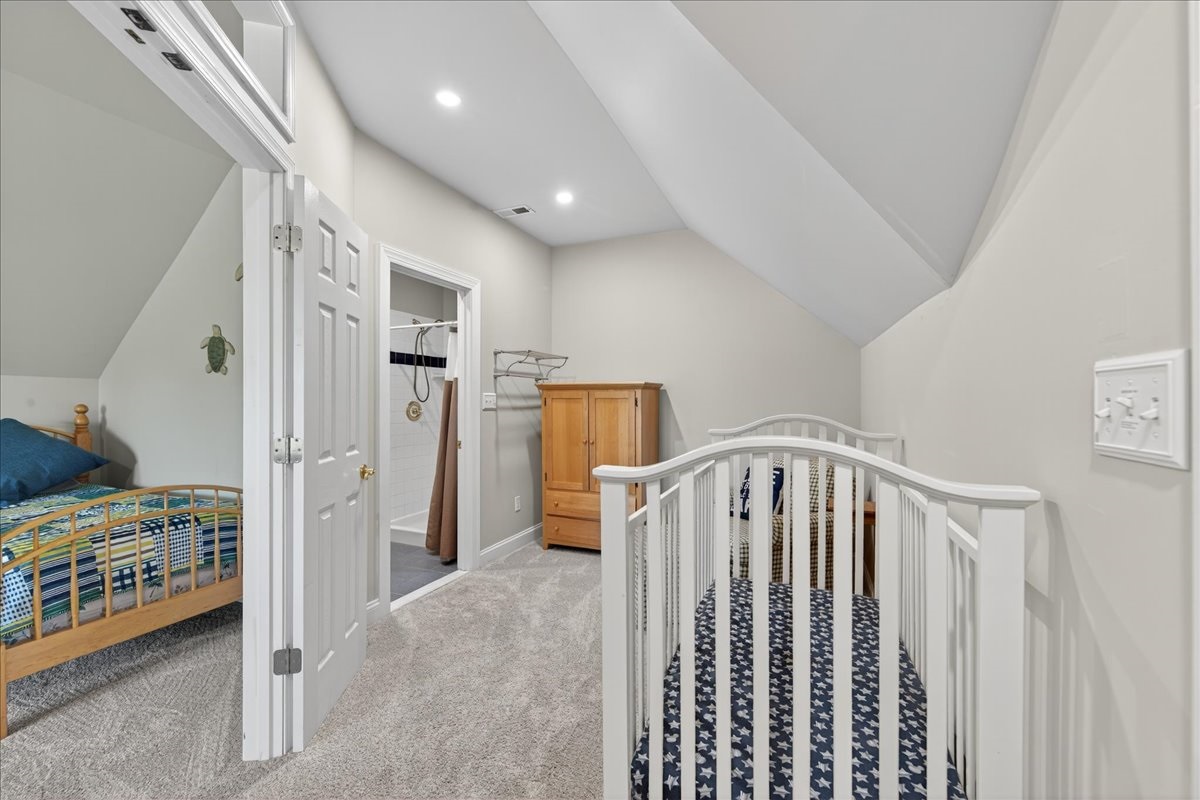 Large upstairs bedroom with flexible sleeping for kids and guests.