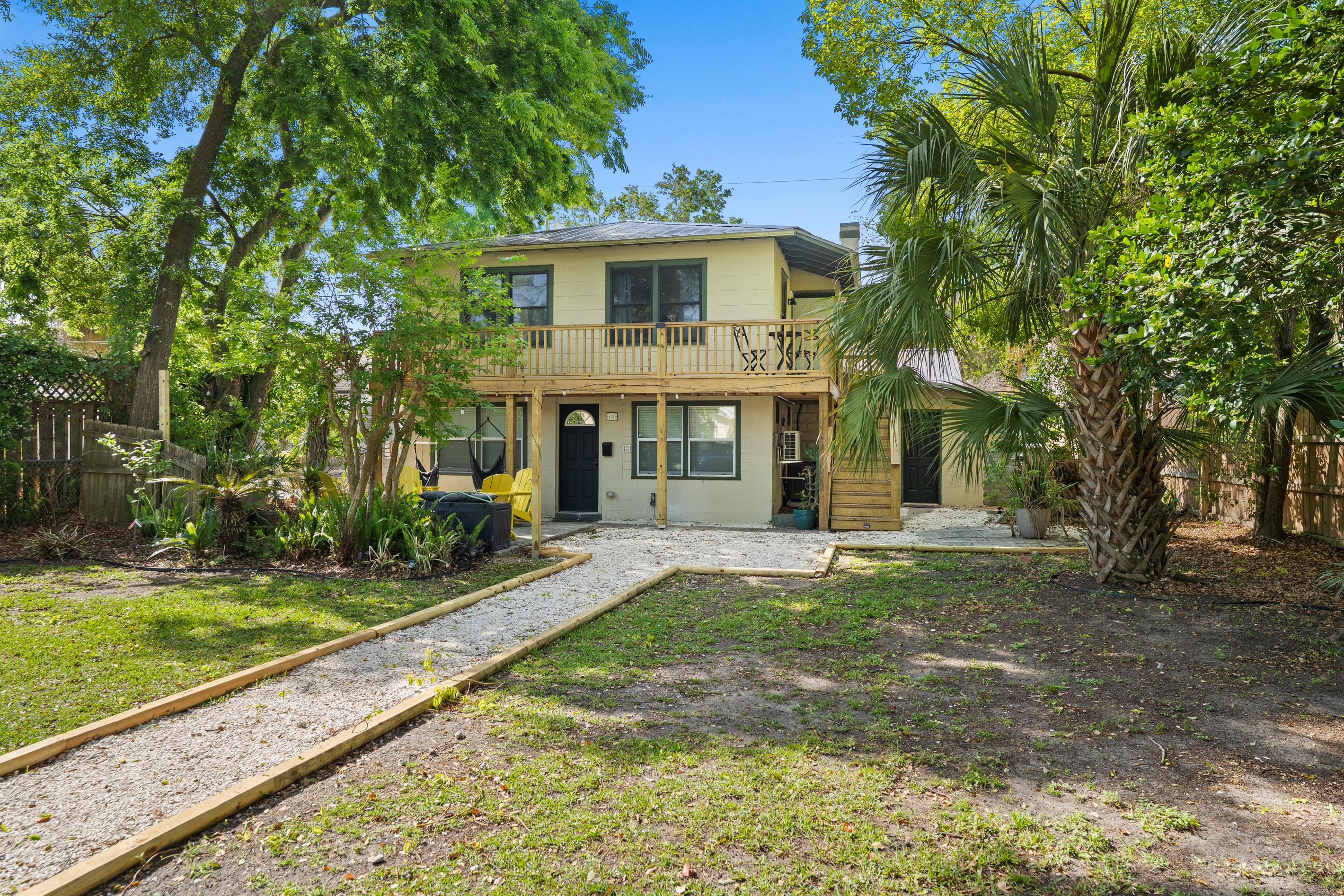 A park like atmosphere created by large shade trees and shell path