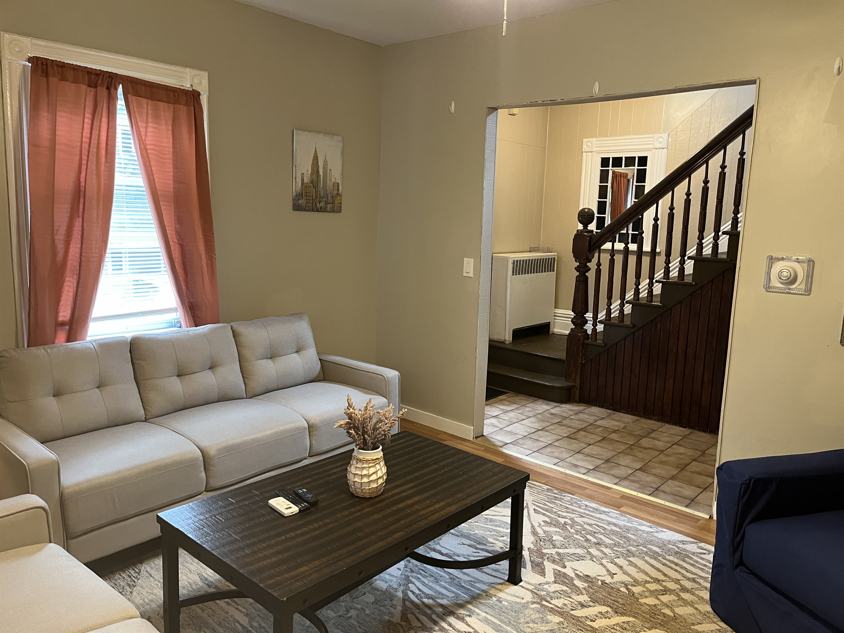 Living room with stairs to 2nd floor