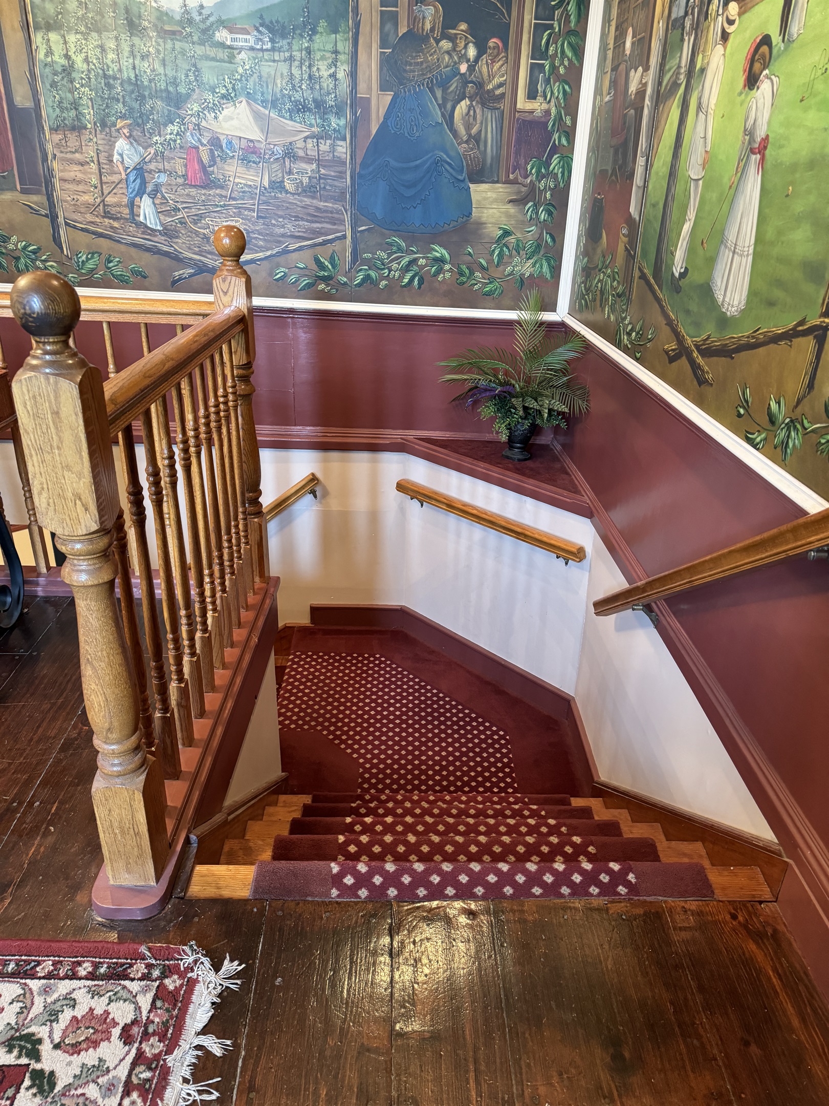 Main stars in lobby leading down to the Traven, dining area and kitchen.