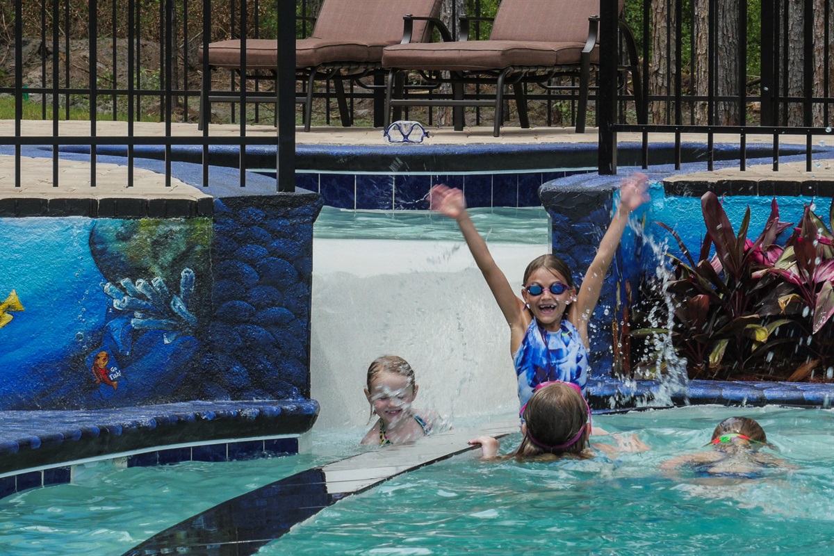 Kids splashing in pool at Clermont lakefront vacation home