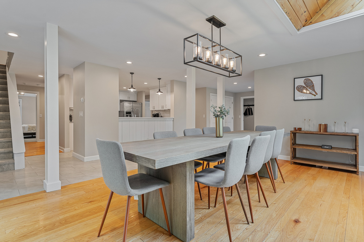 Open-concept dining area flowing into the kitchen and living room of this five-bedroom Vermont rental