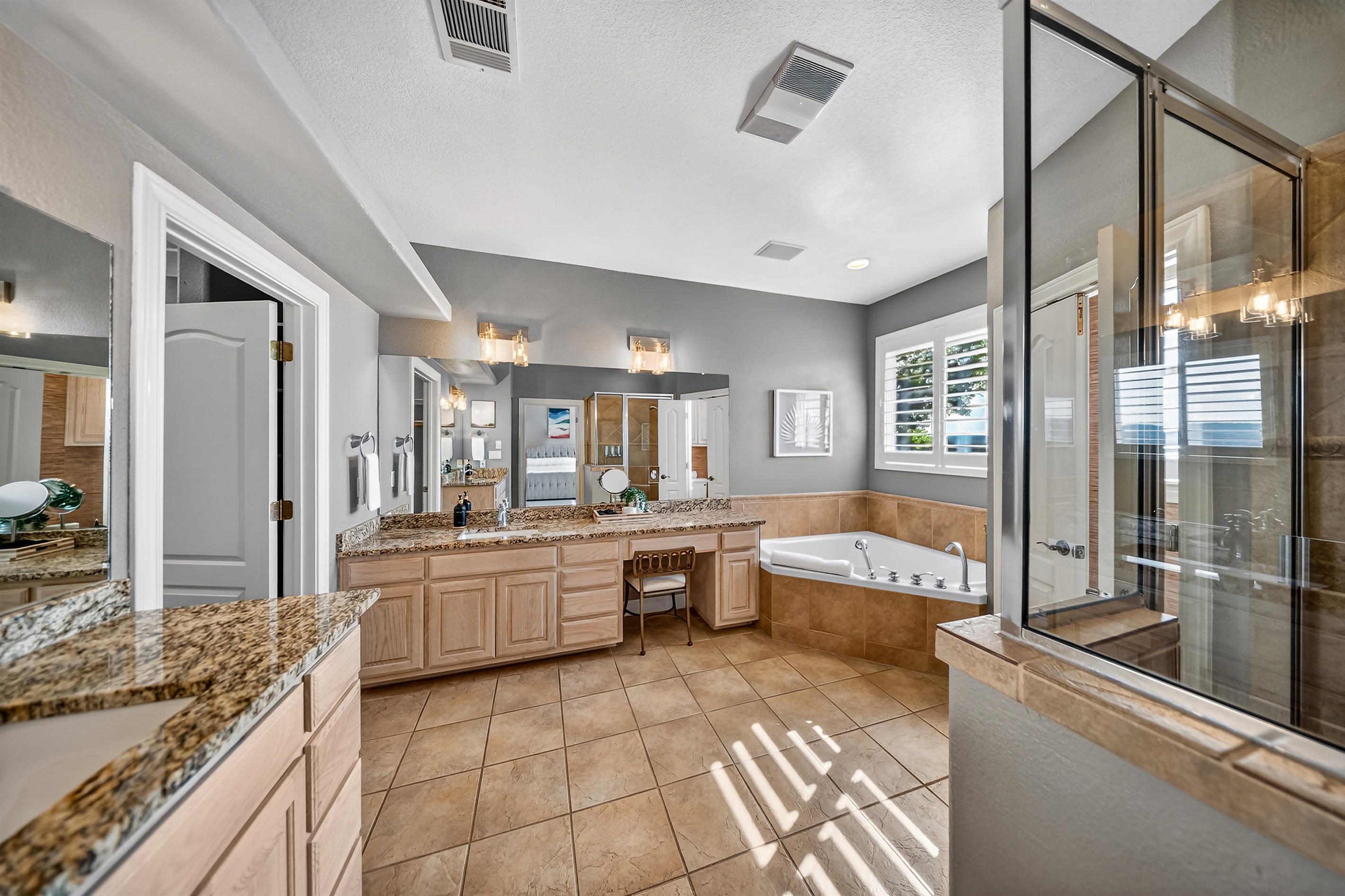 Private ensuite bathroom with a soaking tub, standalone walk in shower, and separate toilet room. Includes a large walk in closet with plenty of space to settle in and feel at home.