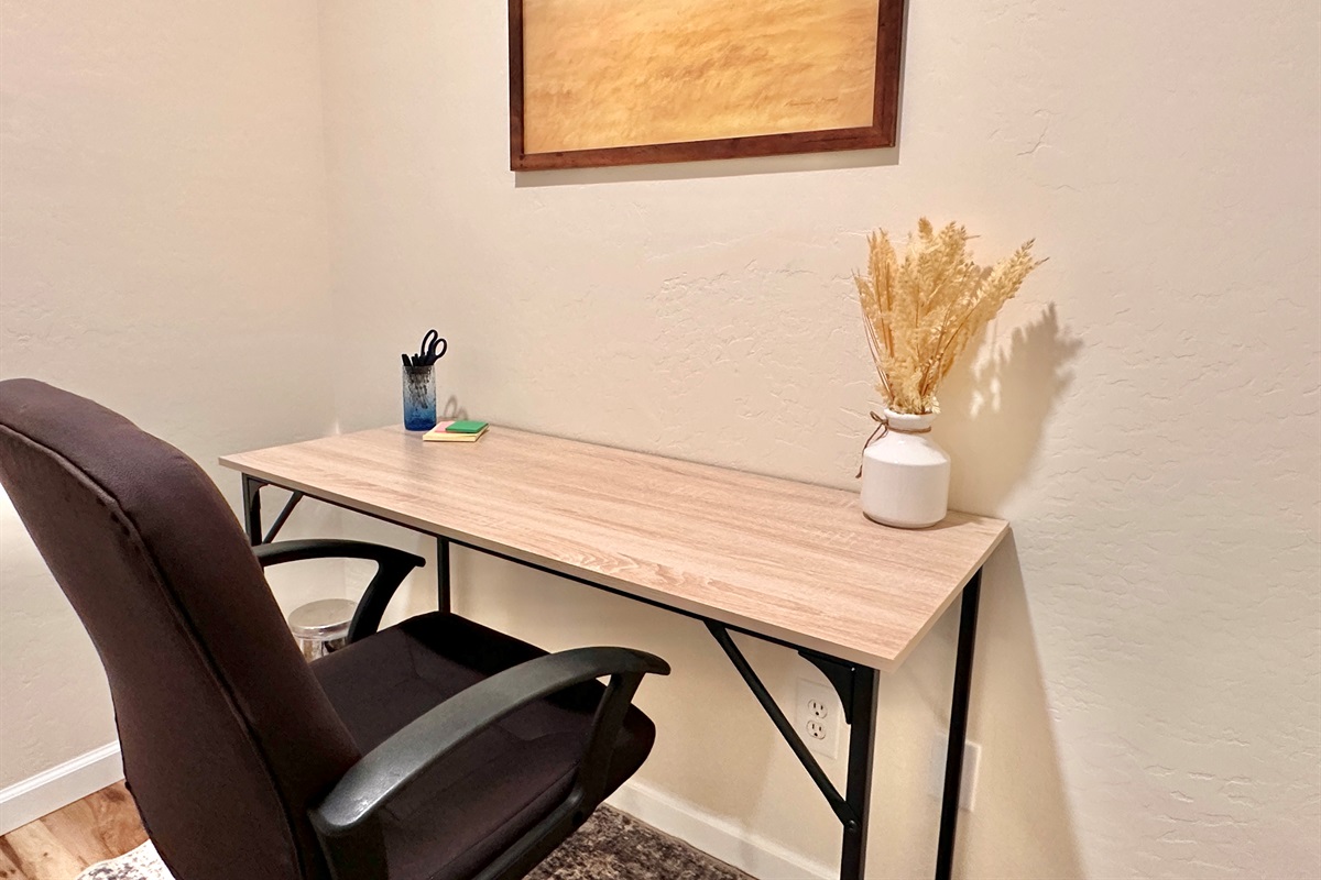 Work station with desk and office chair, perfect for working remotely.