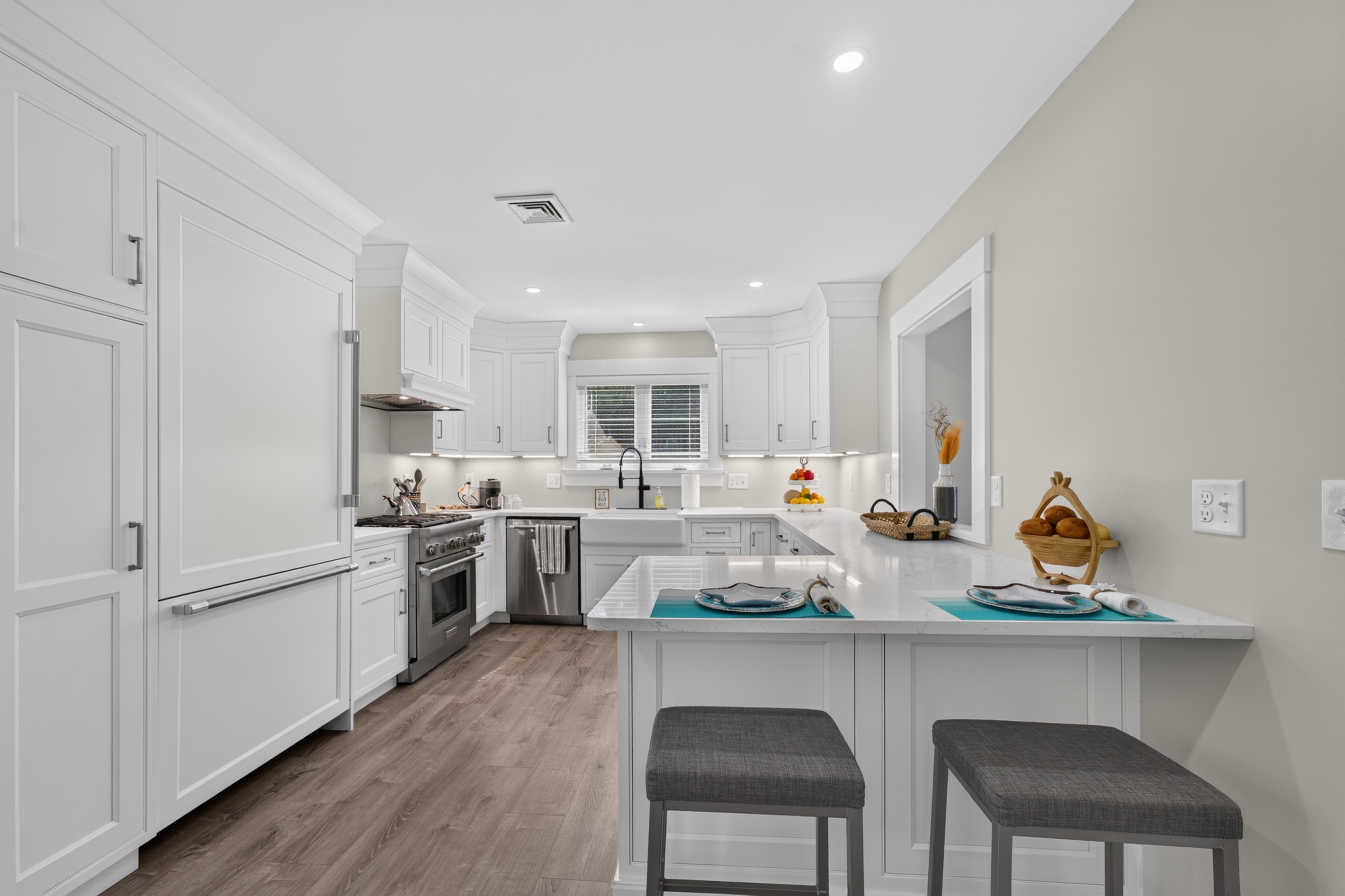 Modern open kitchen featuring ample counter space, bar seating, and everything needed to prepare your favorite meals.