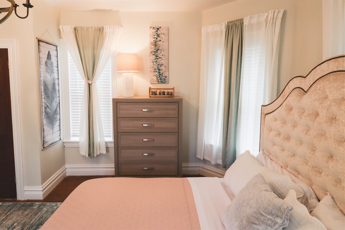 king bed in spacious front of the house room