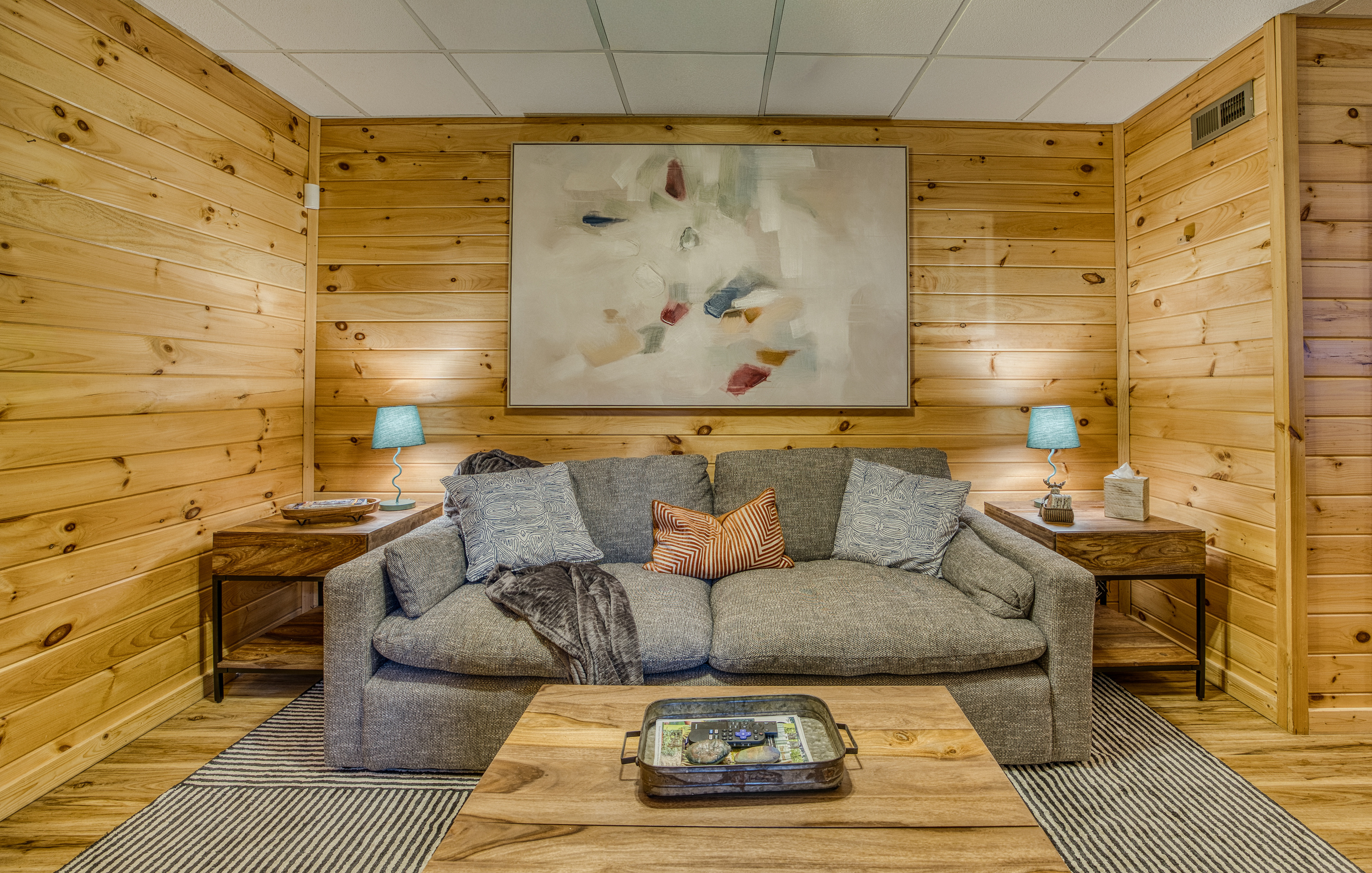 Cozy sofa area with artwork.