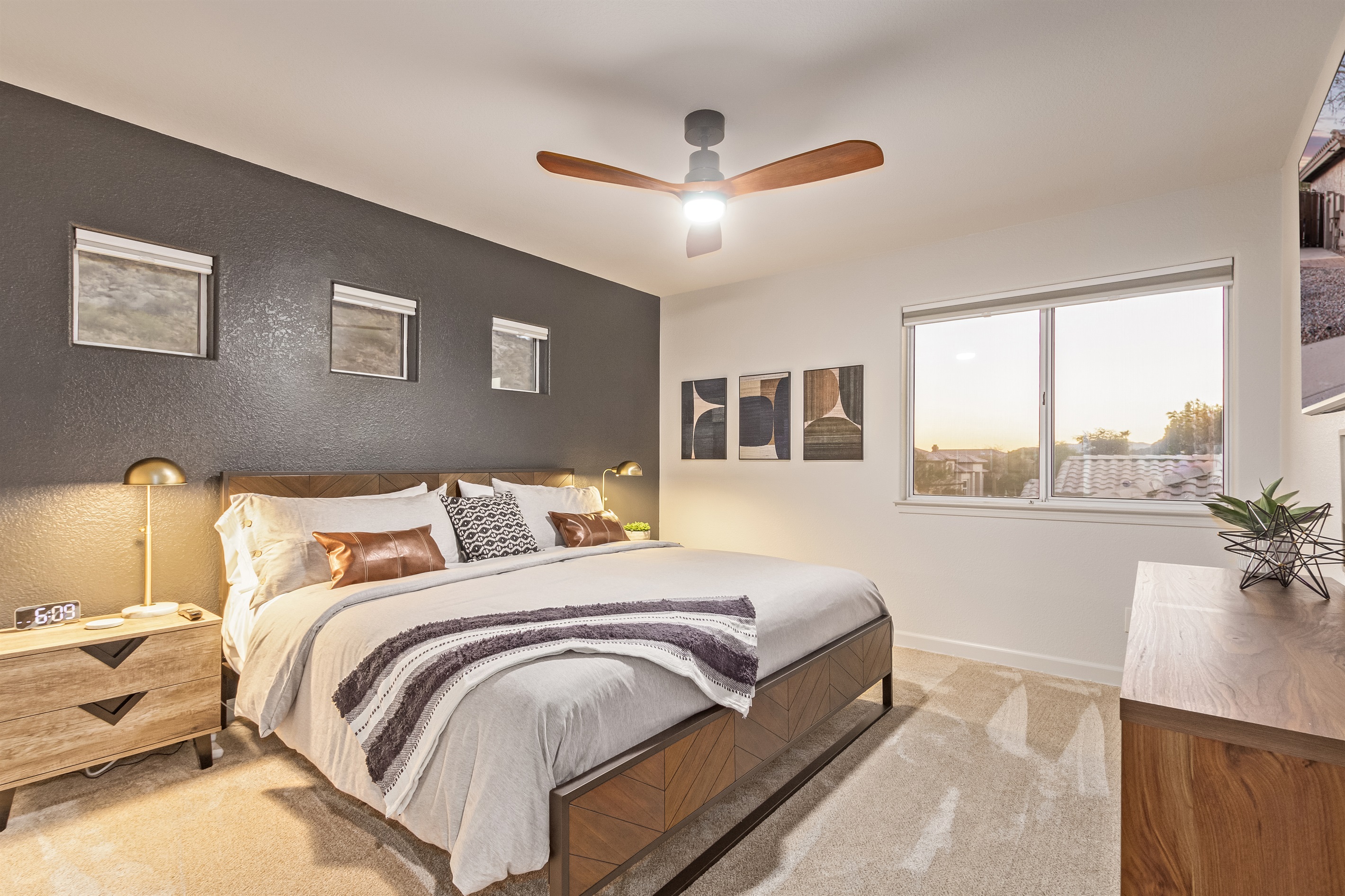 Fourth bedroom with king bed, 55" TV, ceiling fans, extra pillow and blankets, clothing storage, and room darkening shades 