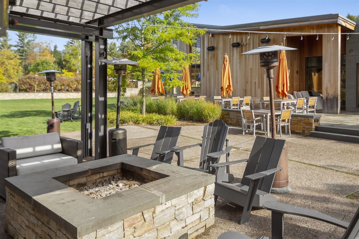 Relax by the firepit next to The Roost