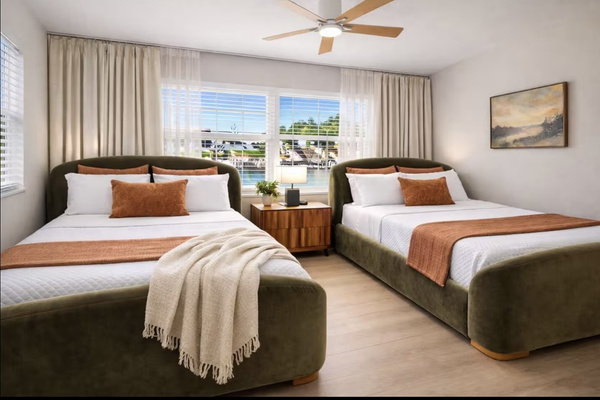 Guest bedroom with two queen beds ideal for families and groups