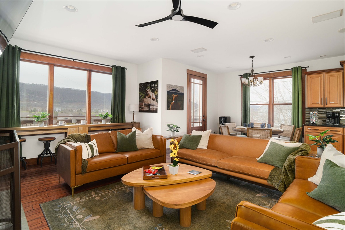 A spacious living area with scenic views and comfortable seating — ideal for spreading out or enjoying quieter moments.