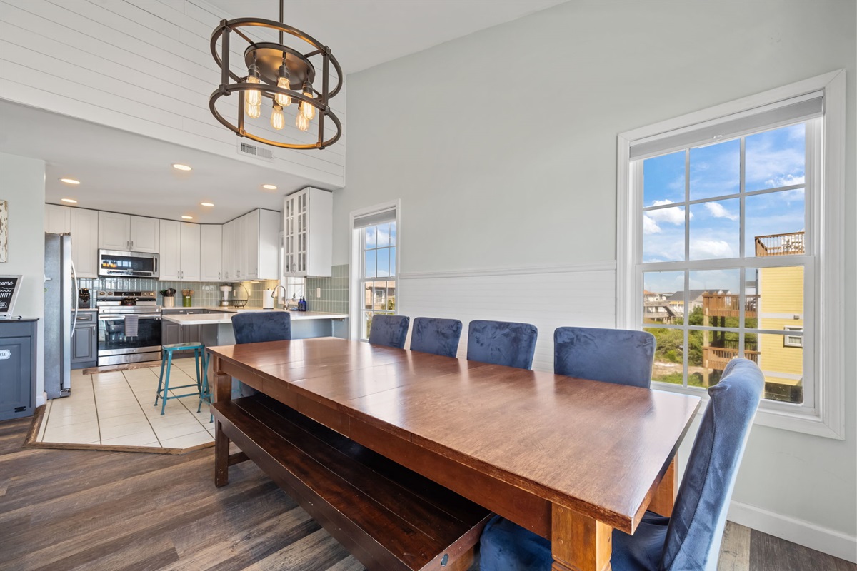 Open-concept dining area featuring a large wooden table