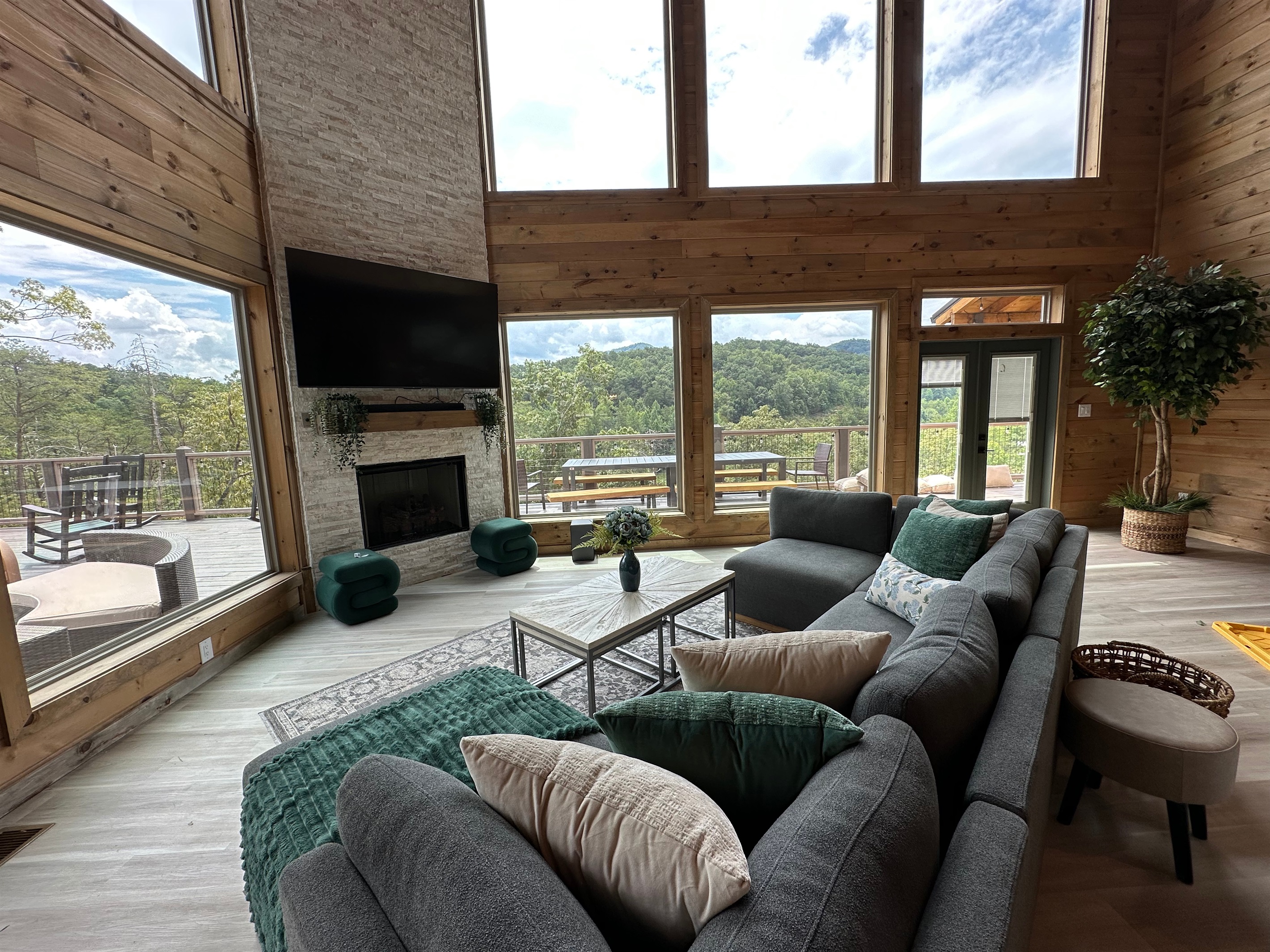 Soaring windows and cozy seating frame sweeping mountain views in this inviting great room. Gather for movie nights, fireside chats, or quiet mornings soaking in the scenery just beyond the glass.