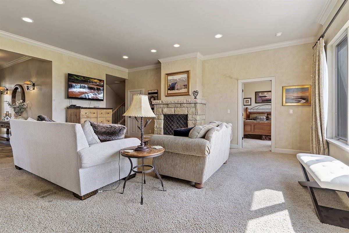 Spacious living room with plenty of seating and natural light.