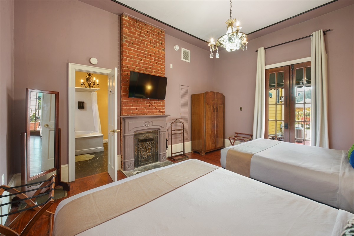 Marsalis double queen bedroom with chandelier