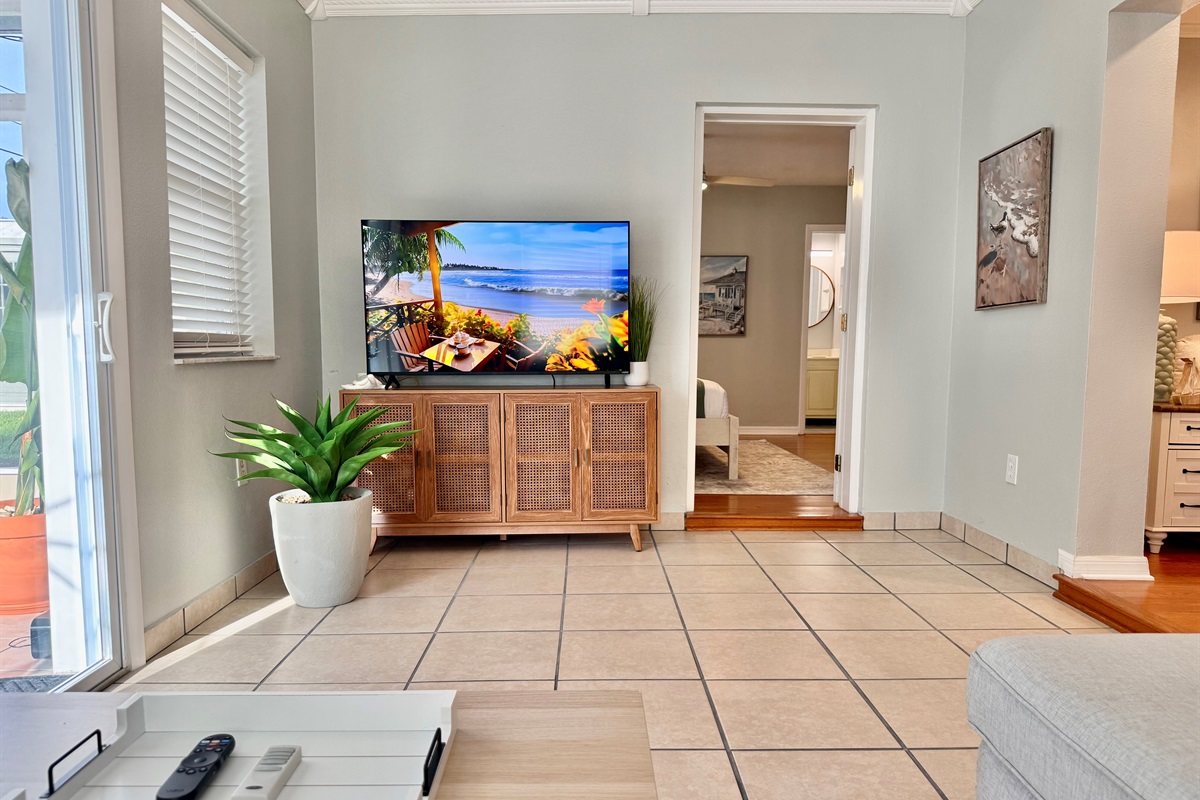 Feel instantly at home in this peaceful living space, where a calming color palette and soft seating invite you to relax.