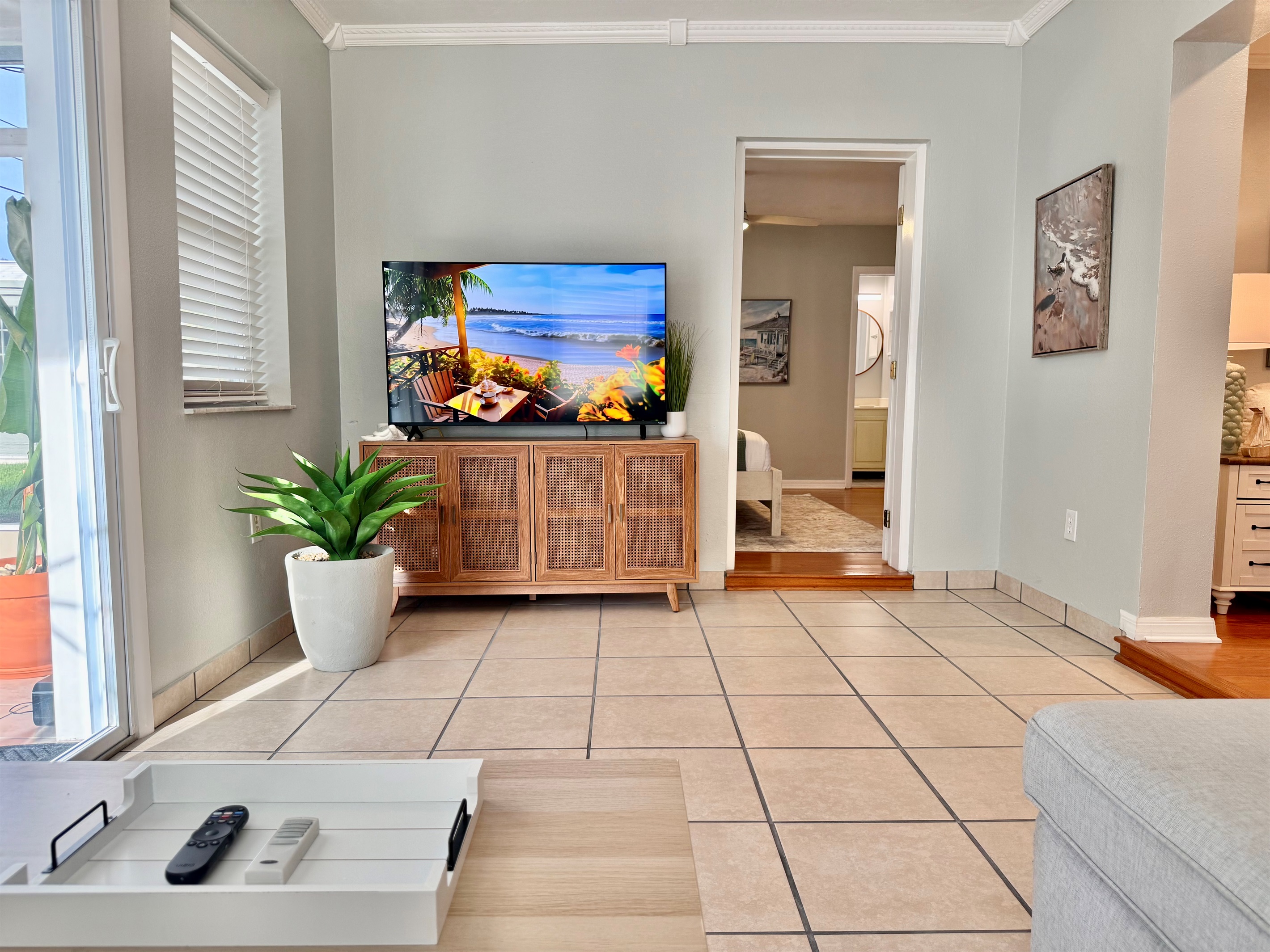 Feel instantly at home in this peaceful living space, where a calming color palette and soft seating invite you to relax.