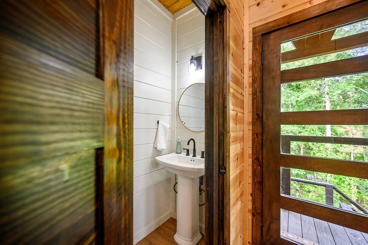 Stylish powder room just off the main living area.