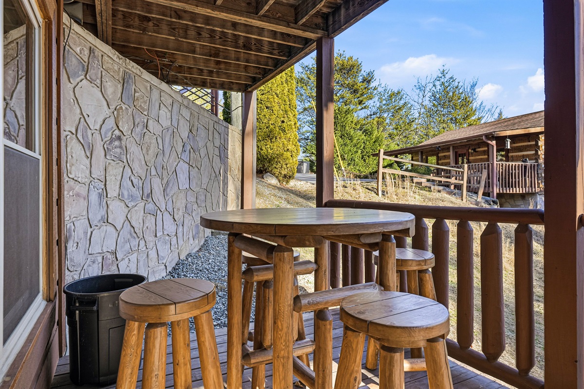 Wake up to breathtaking Smoky Mountain views from your private cabin porch near Gatlinburg, TN | Cozy covered deck seating perfect for stargazing, coffee mornings & unforgettable Tennessee sunsets | Your Pigeon Forge & Sevierville mountain escape awaits