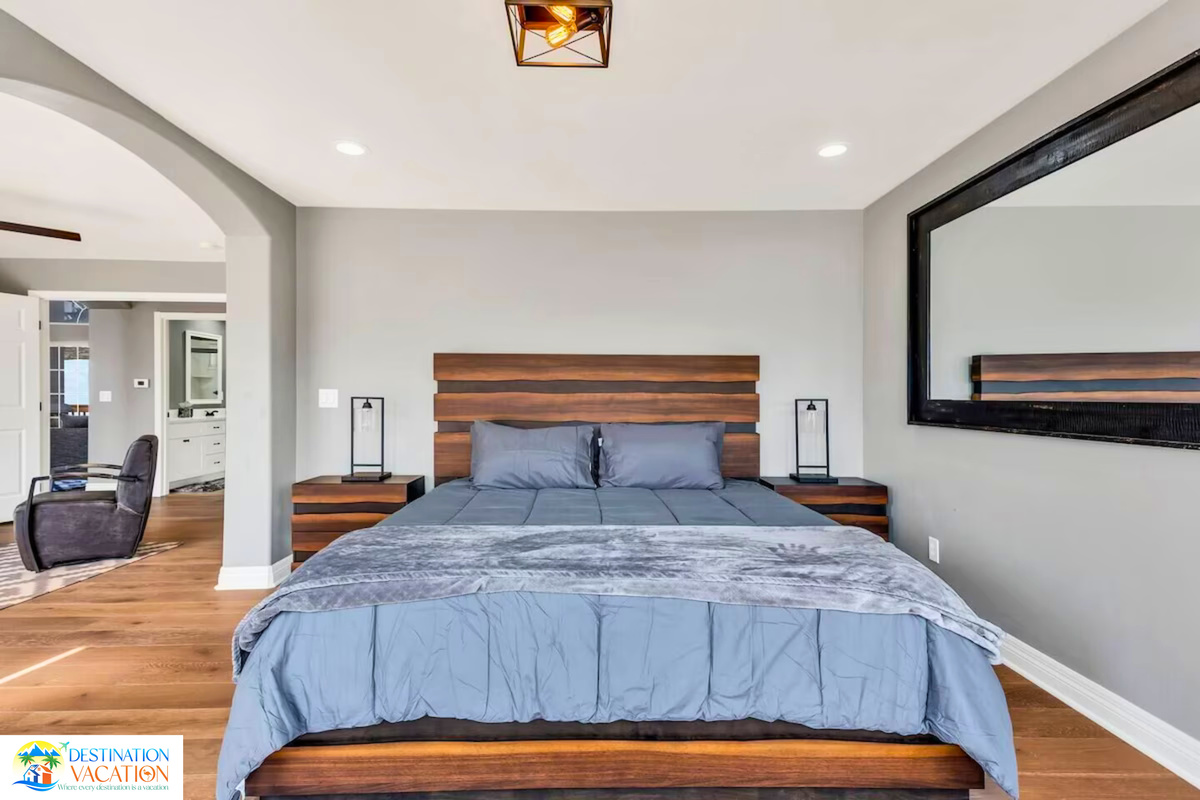 Elegant bedroom offers comfort with expansive scenic views.