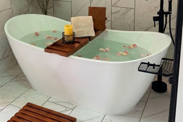 Master Bathroom: Indulge in a spa-like retreat with our deep, freestanding soaking tub, designed with ergonomic curves for the ultimate full-body relaxation.