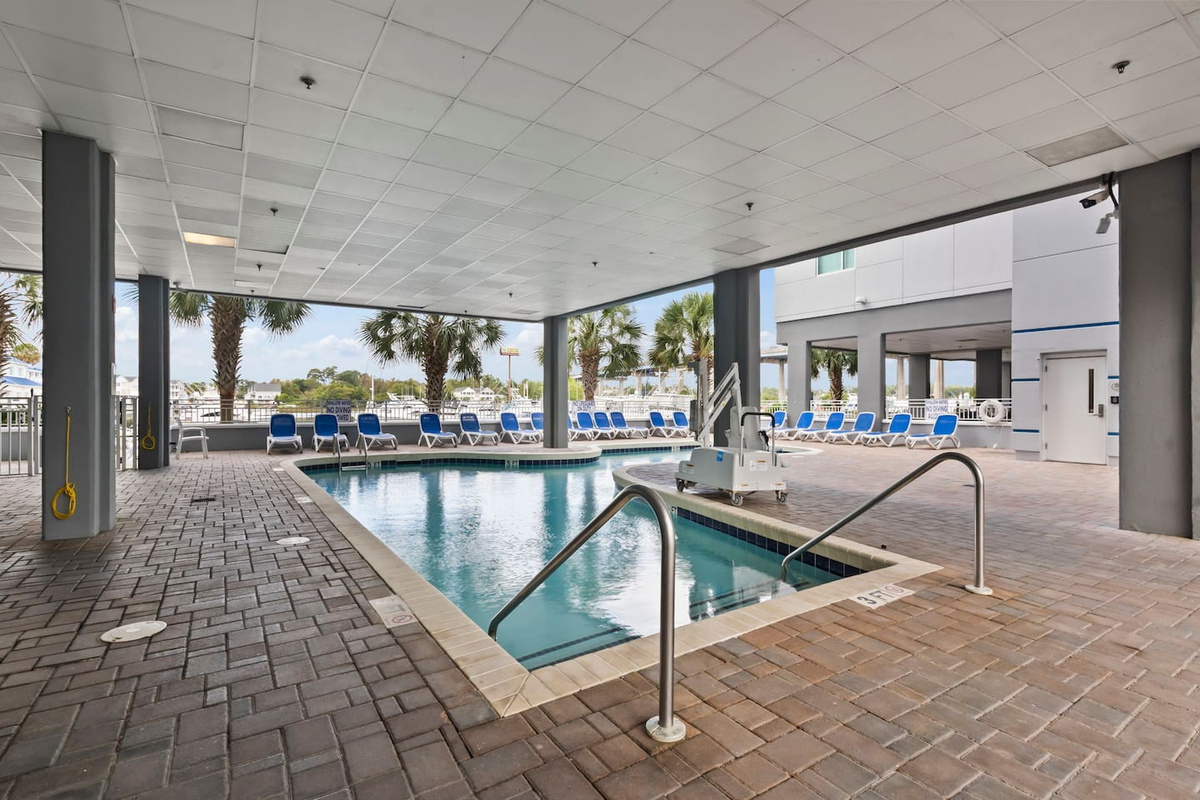 Resort-style community pool with marina views—relax and soak up the coastal sun