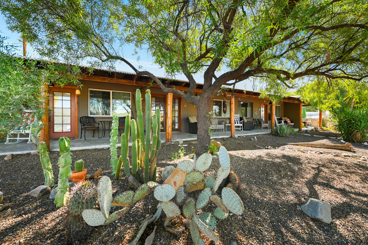 Lush Landscaping and covered patio in front